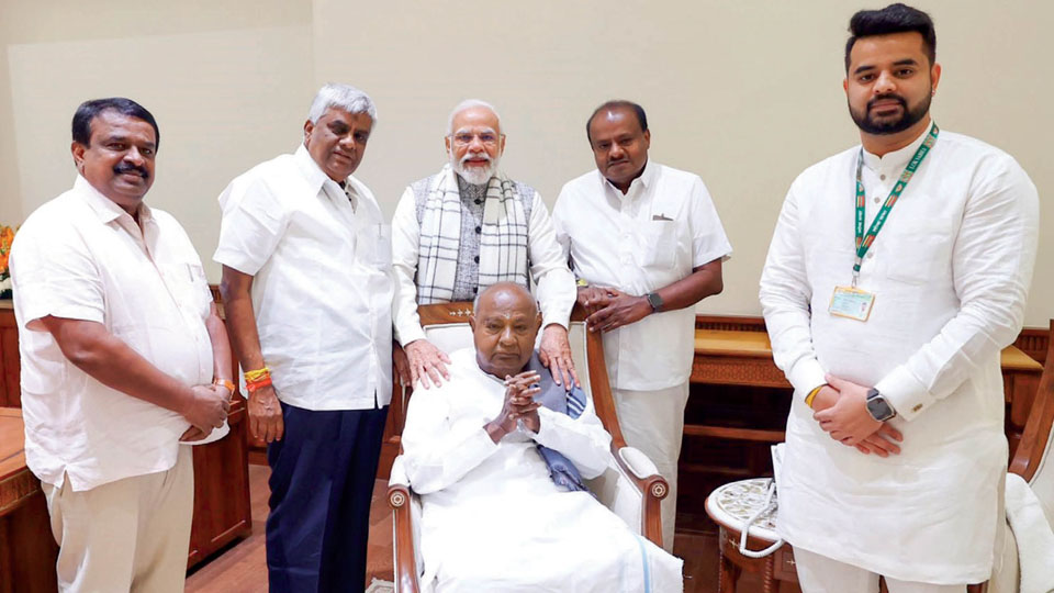 H.D. Deve Gowda, kin meet Modi